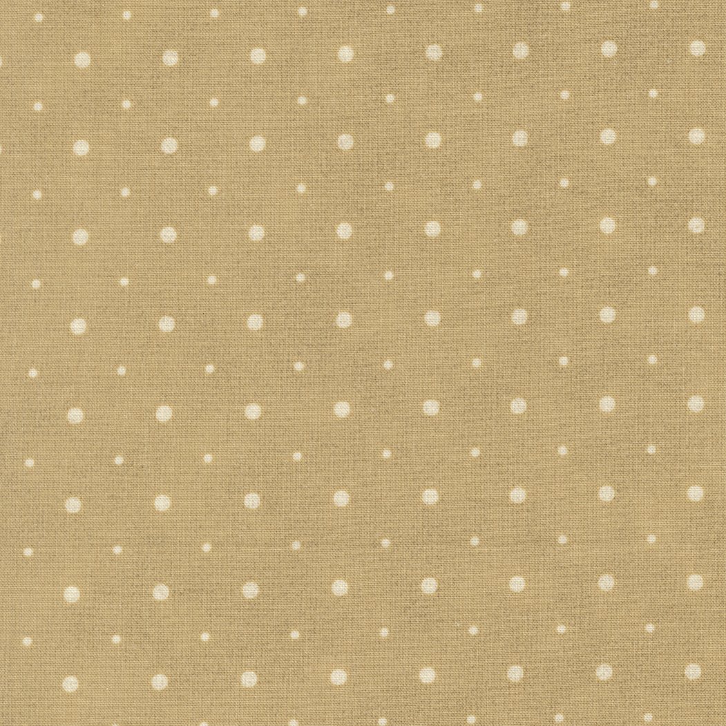 Beige fabric with white polka dots.