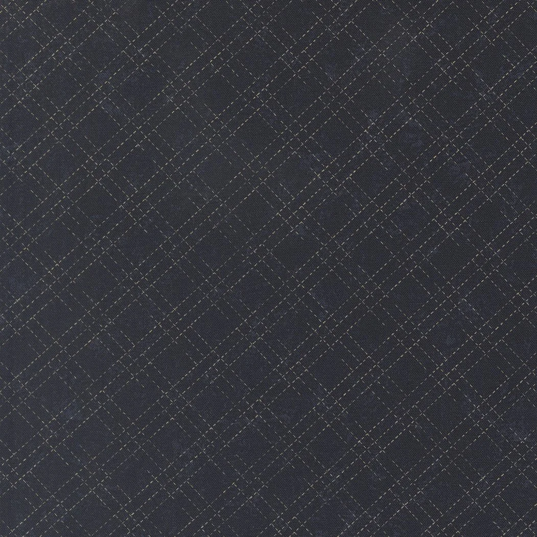Dark fabric with a gold diamond and crosshatch pattern.