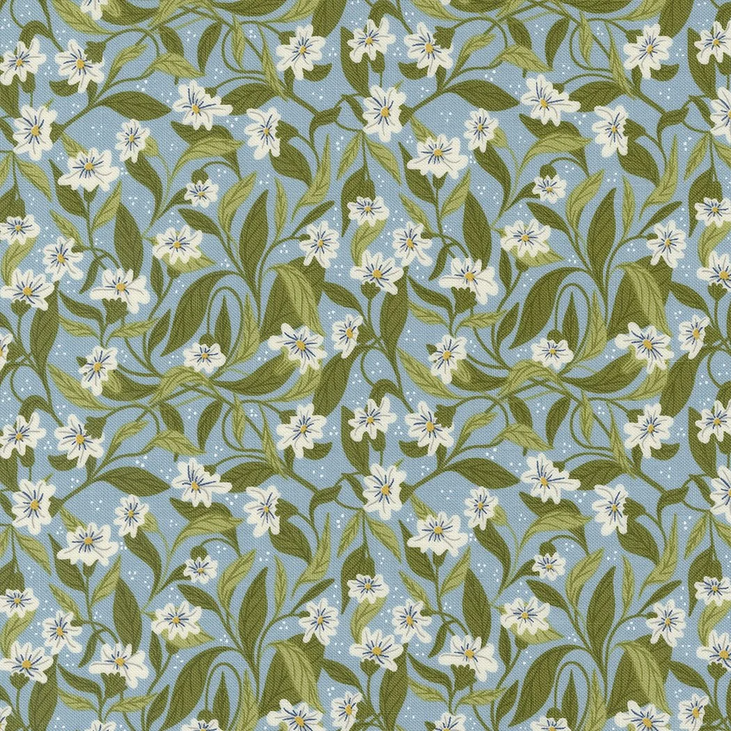 A fabric with a pattern of white flowers and green leaves on a blue background.