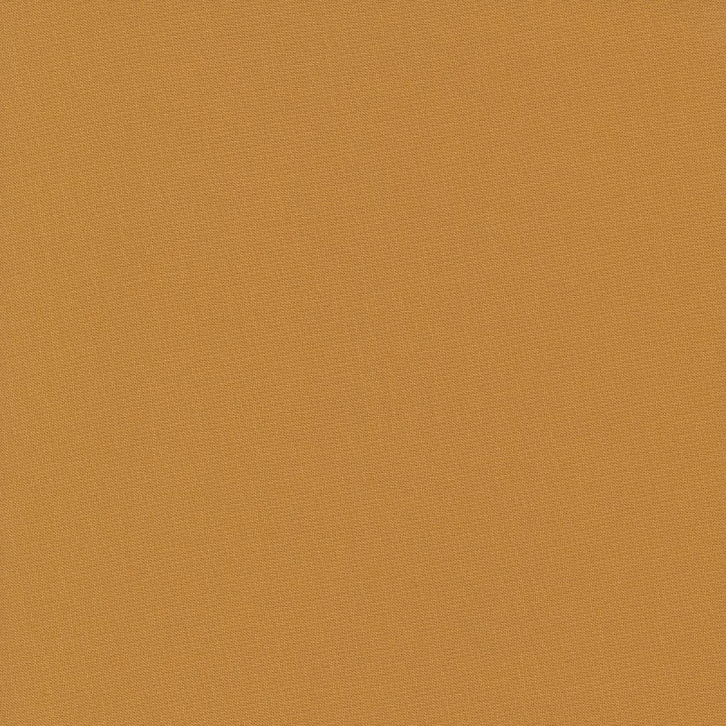 A plain, textured beige or tan surface with no distinct objects or features.
