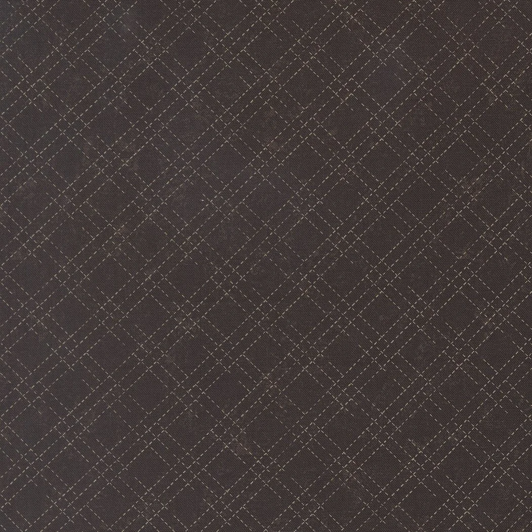 Brown fabric with a white diamond and grid stitch pattern.