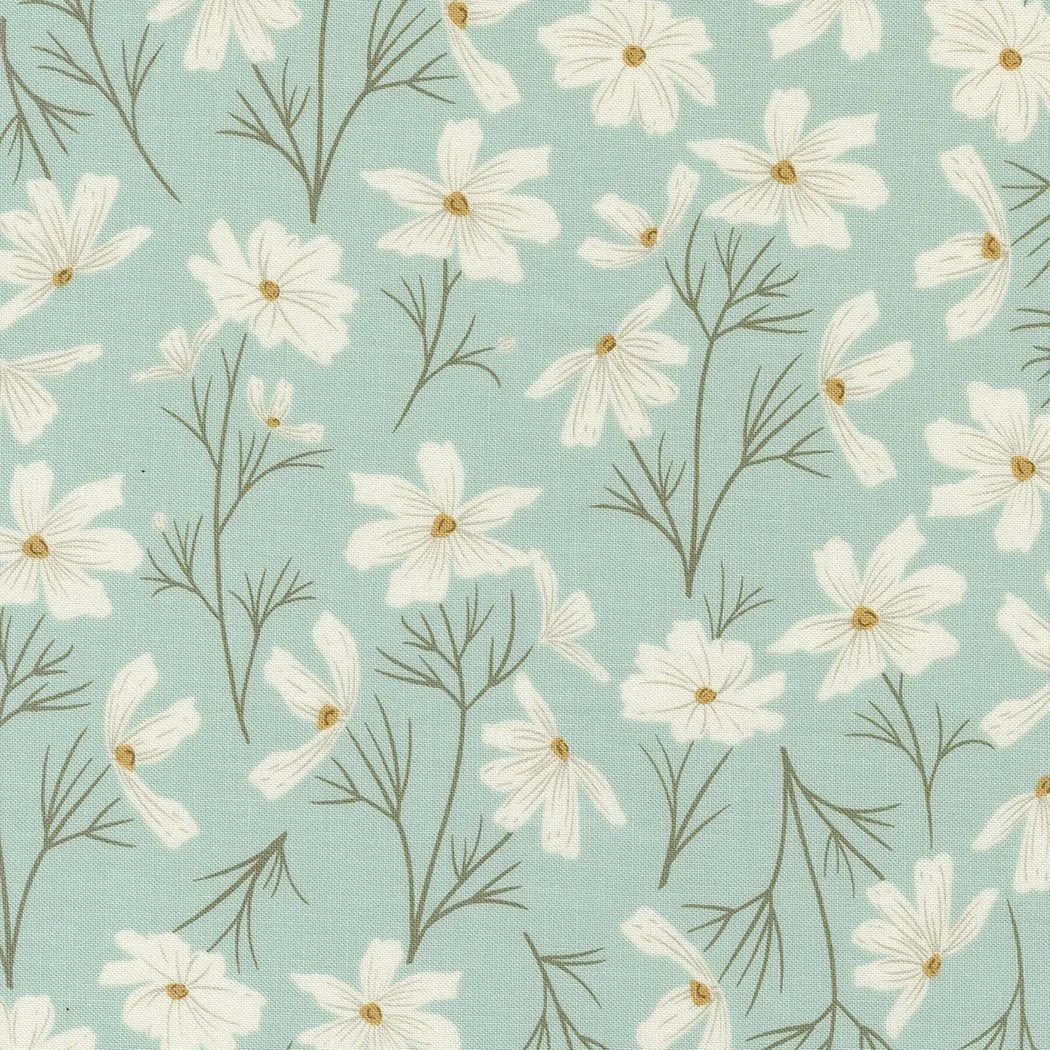 Light blue fabric with a pattern of white daisies and green stems.