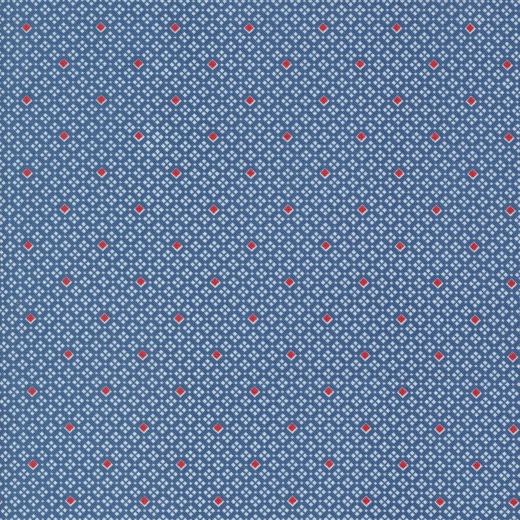 Close-up of blue fabric with a small, repeating diamond pattern in white, and red dots at the center of some diamonds.