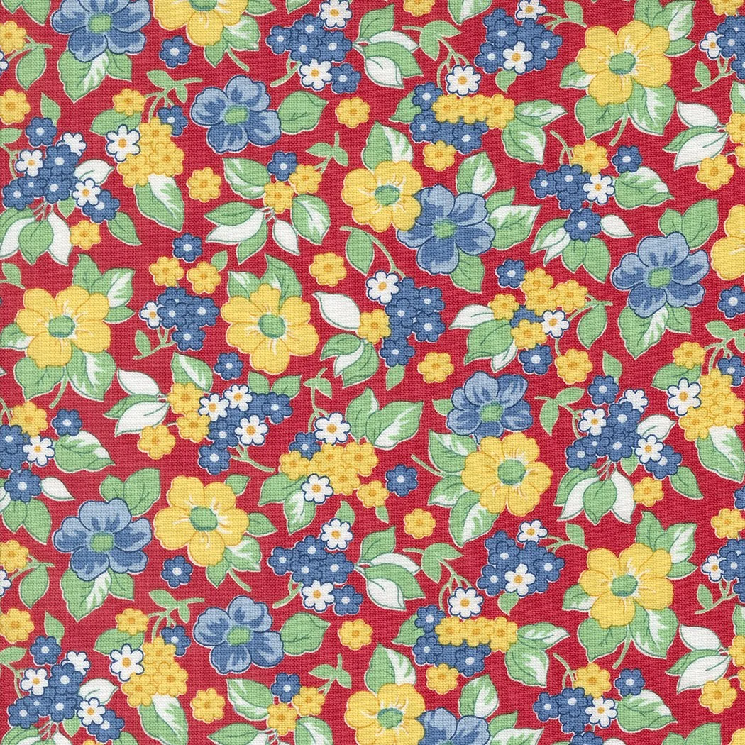 Floral fabric pattern with yellow, blue, and white flowers on a red background.