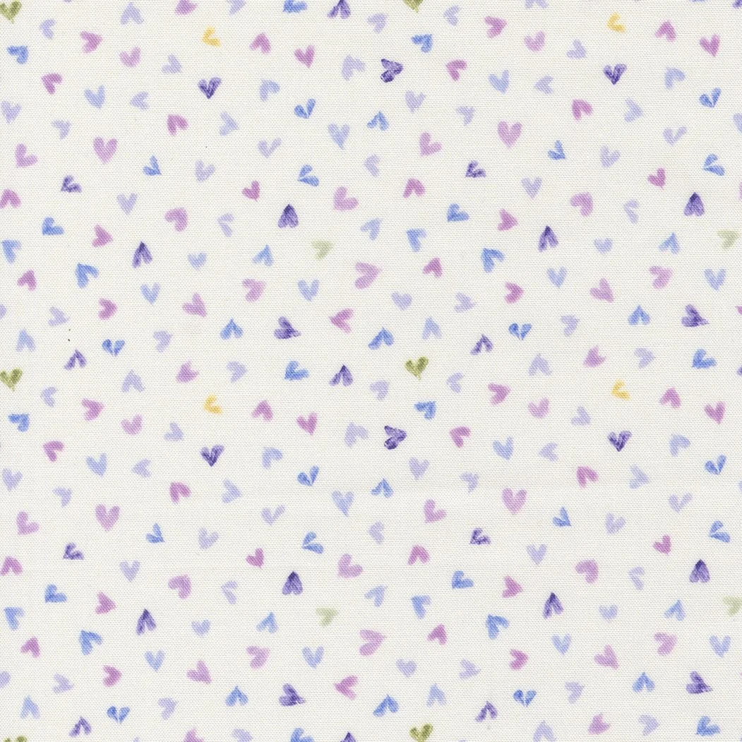 Pattern of small, colorful hearts in pink, purple, blue, green, and yellow on a white background.