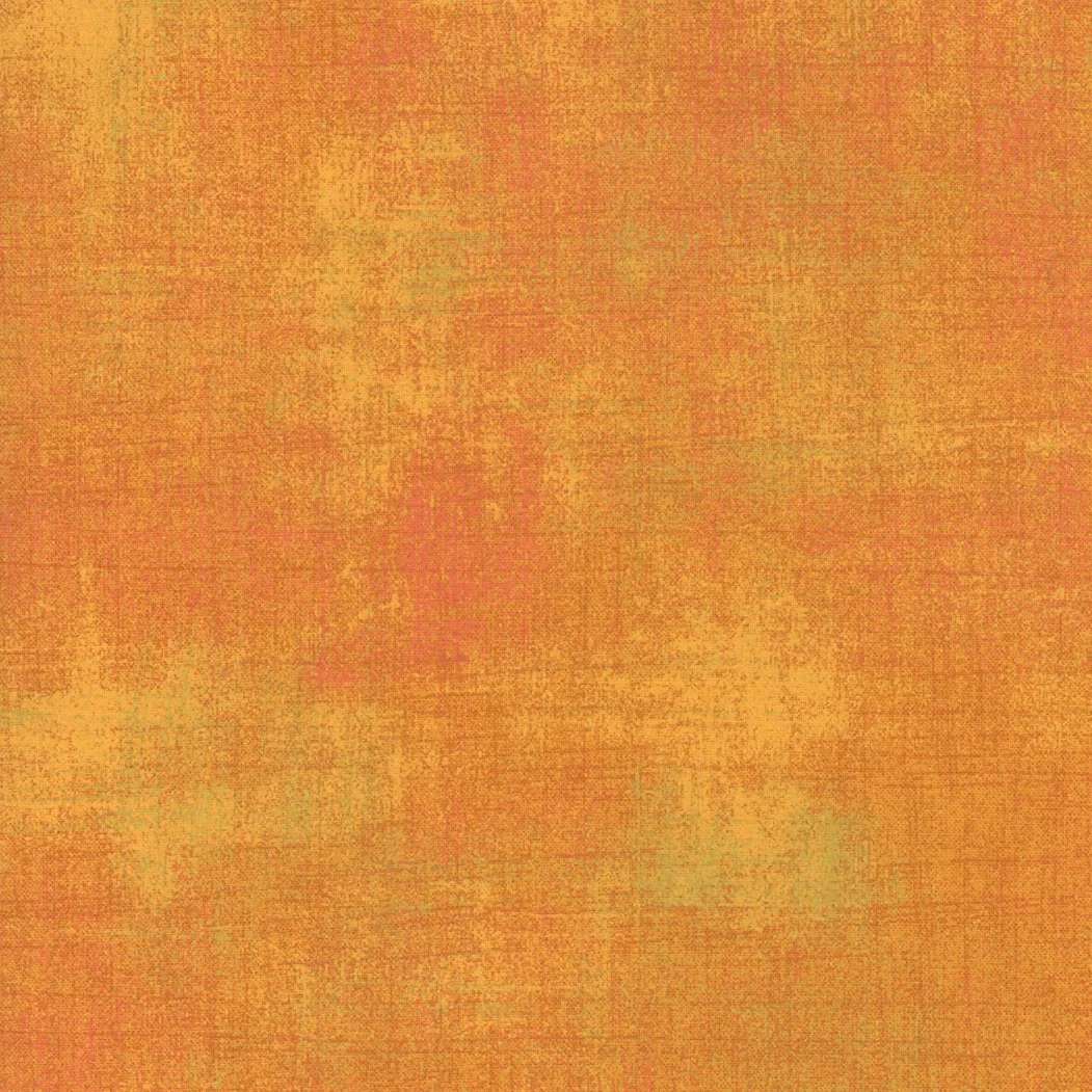 A textured orange and yellow background with a rainbow-like pattern.