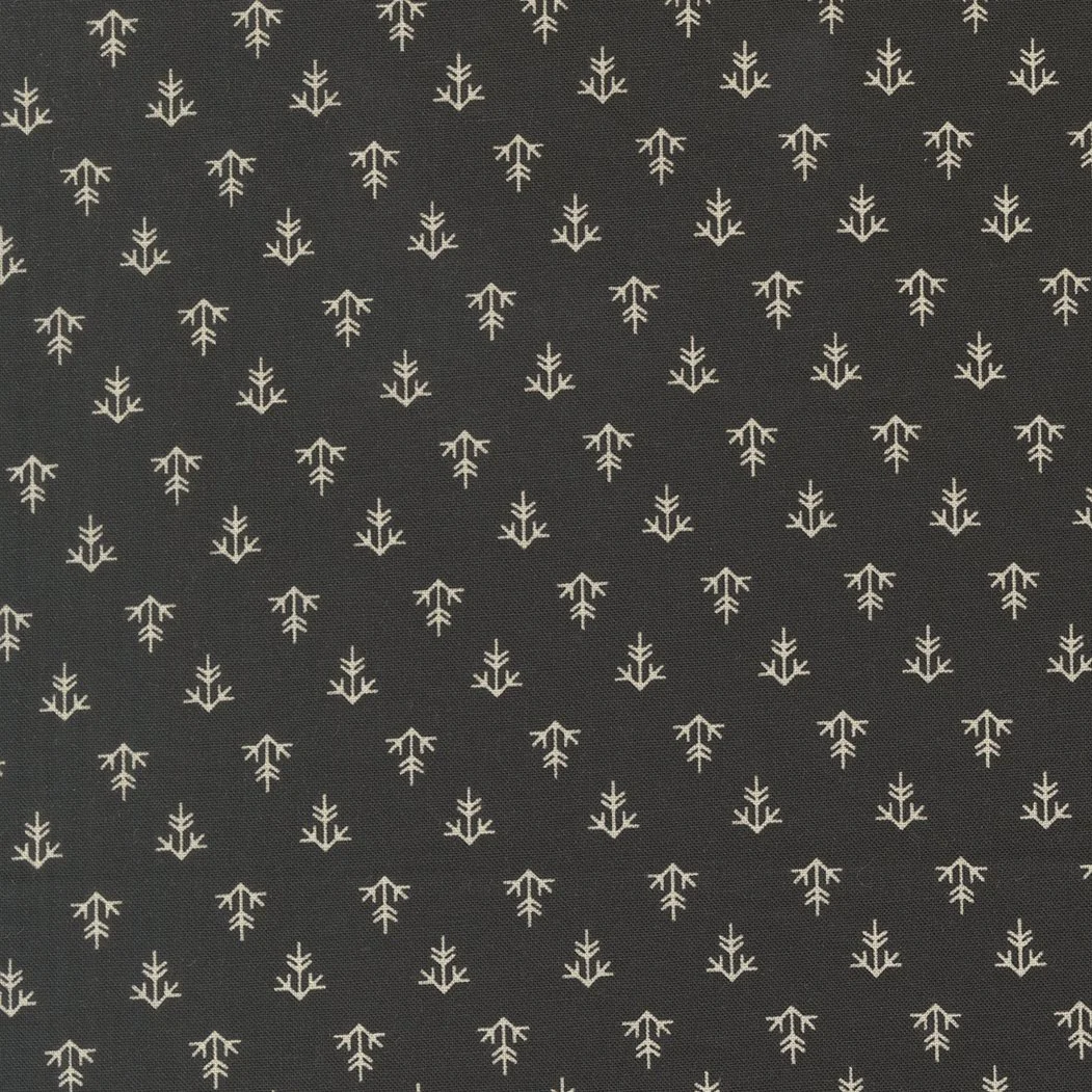 Pattern of small white snowflakes on a black background.