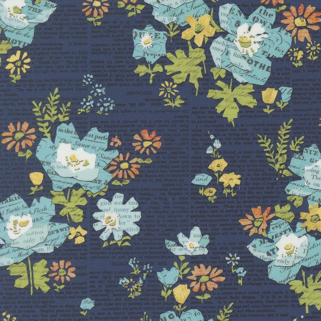 Fabric with a dark blue background featuring a floral pattern of roses, daisies, and other small flowers in shades of blue, yellow, orange, and green, with some flowers made from printed paper.