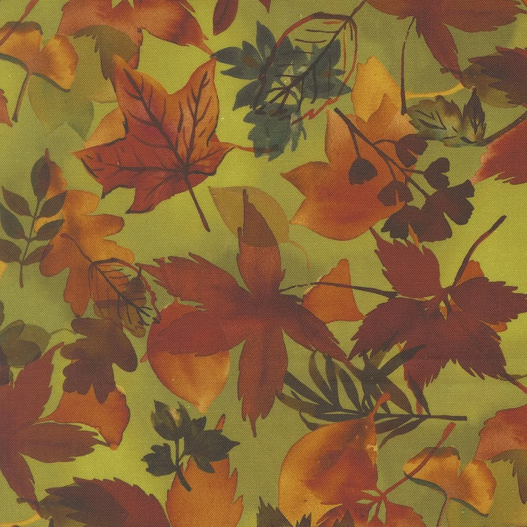 Pattern of colorful autumn leaves in shades of red, orange, yellow, and green on a green background.
