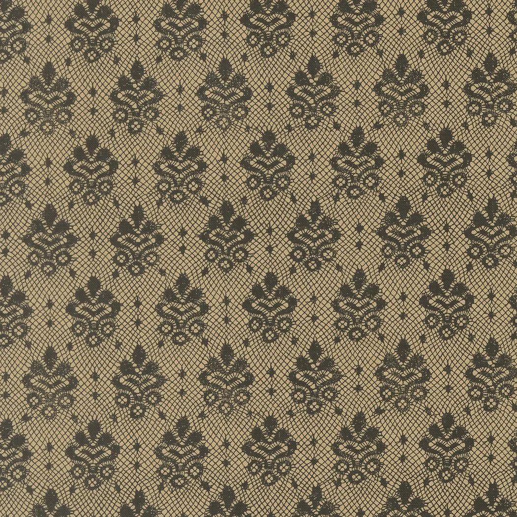 Black damask pattern on a tan background.