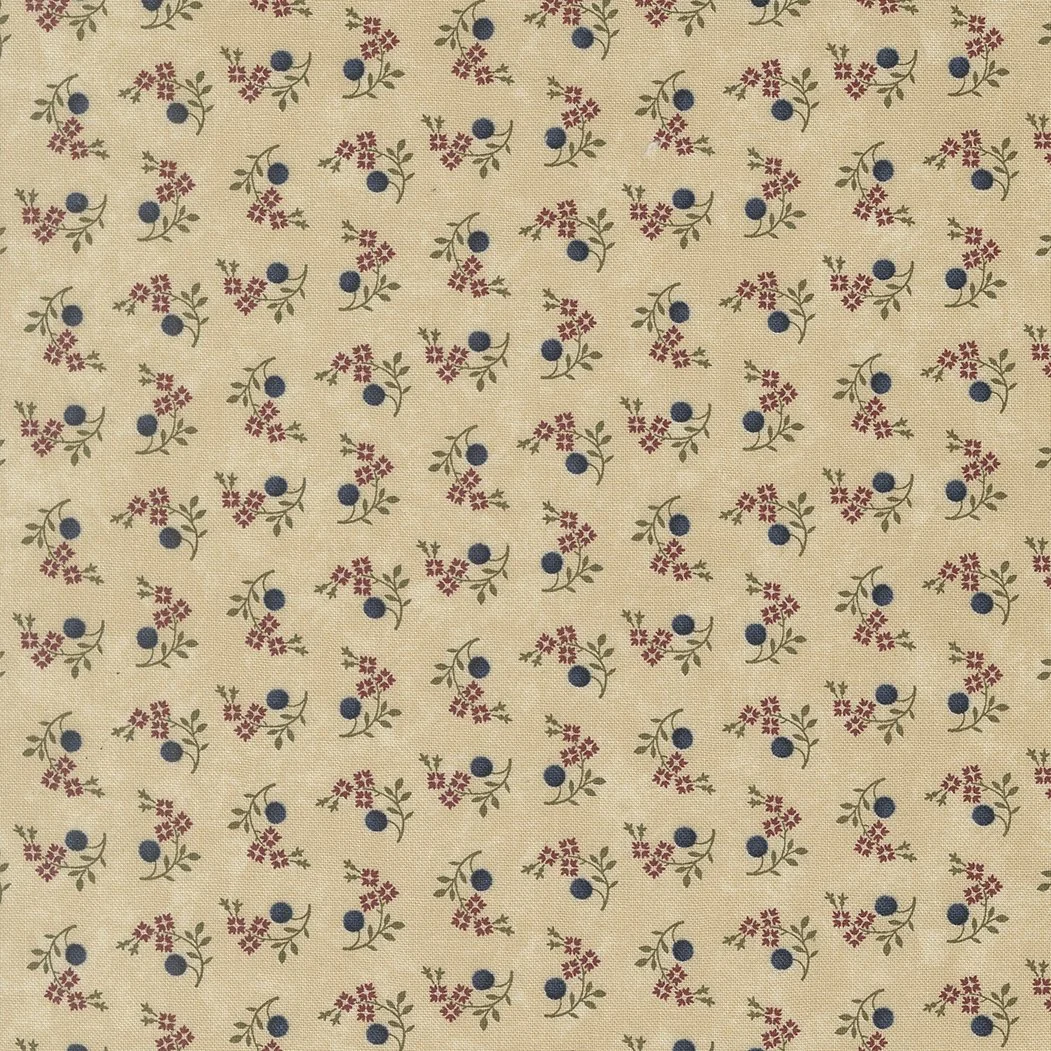 A fabric with a beige background featuring a repeating pattern of small red flowers, green leaves, and blue berries.