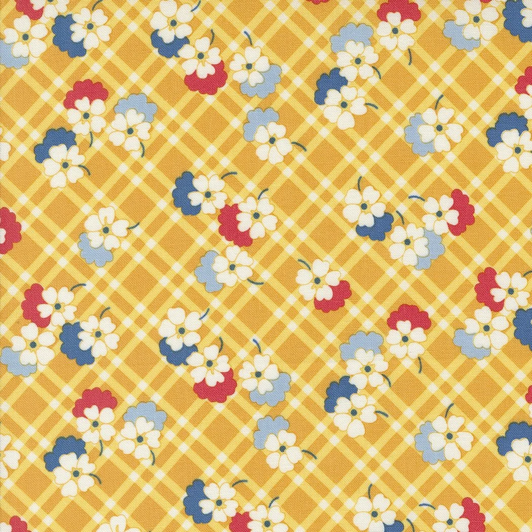 Fabric with a yellow checkered background and a floral pattern of white, blue, and red flowers.