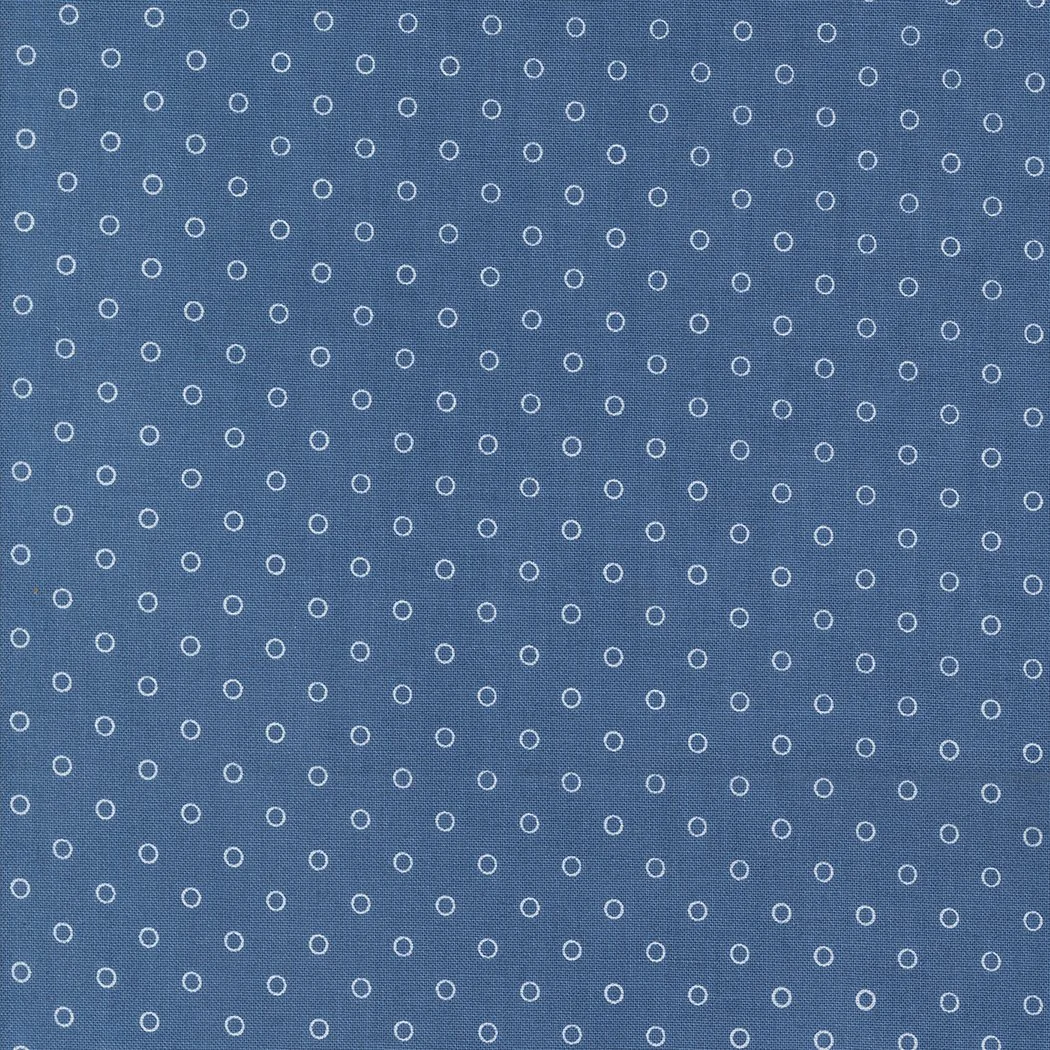 Blue background with a pattern of small white circles evenly spaced.
