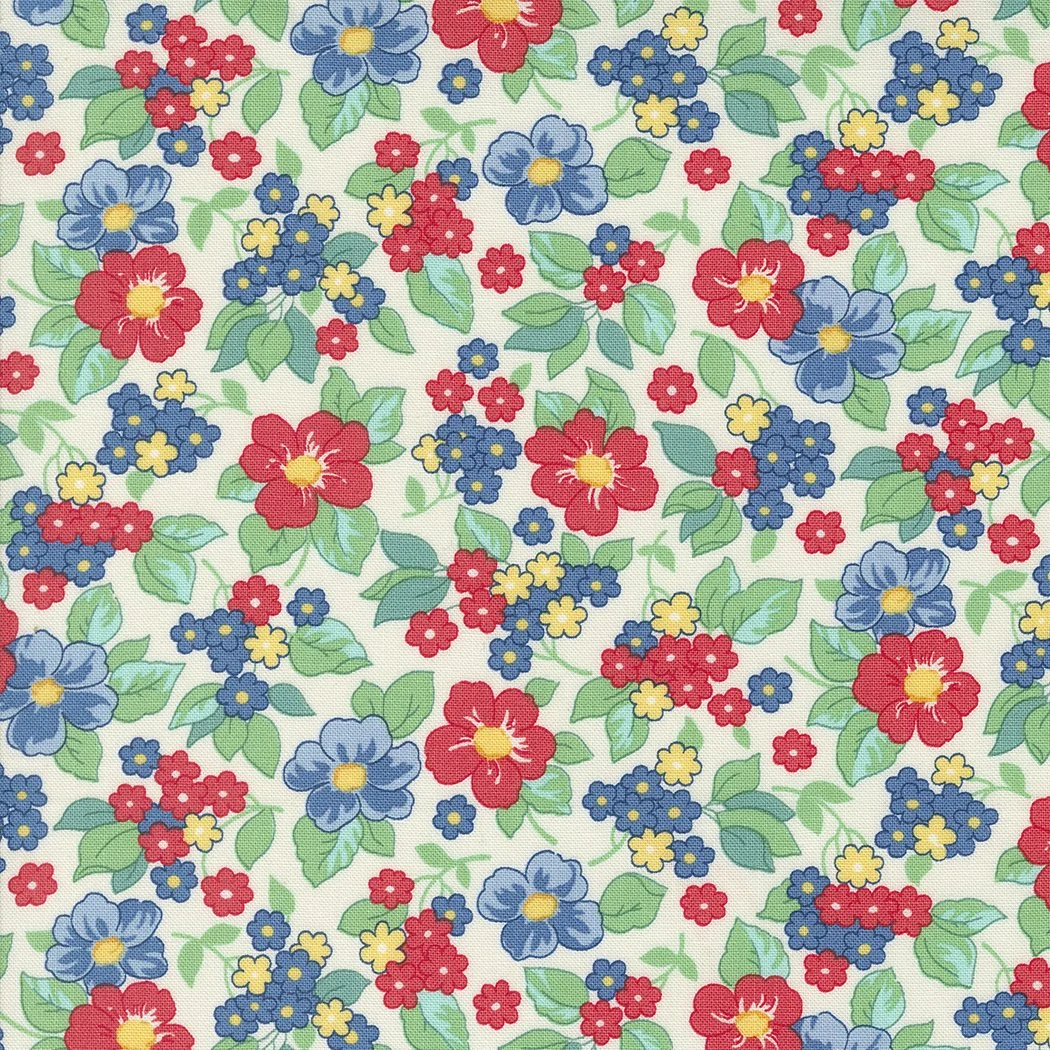 Pattern of various colorful flowers including red, blue, and yellow, with green leaves on a white background.
