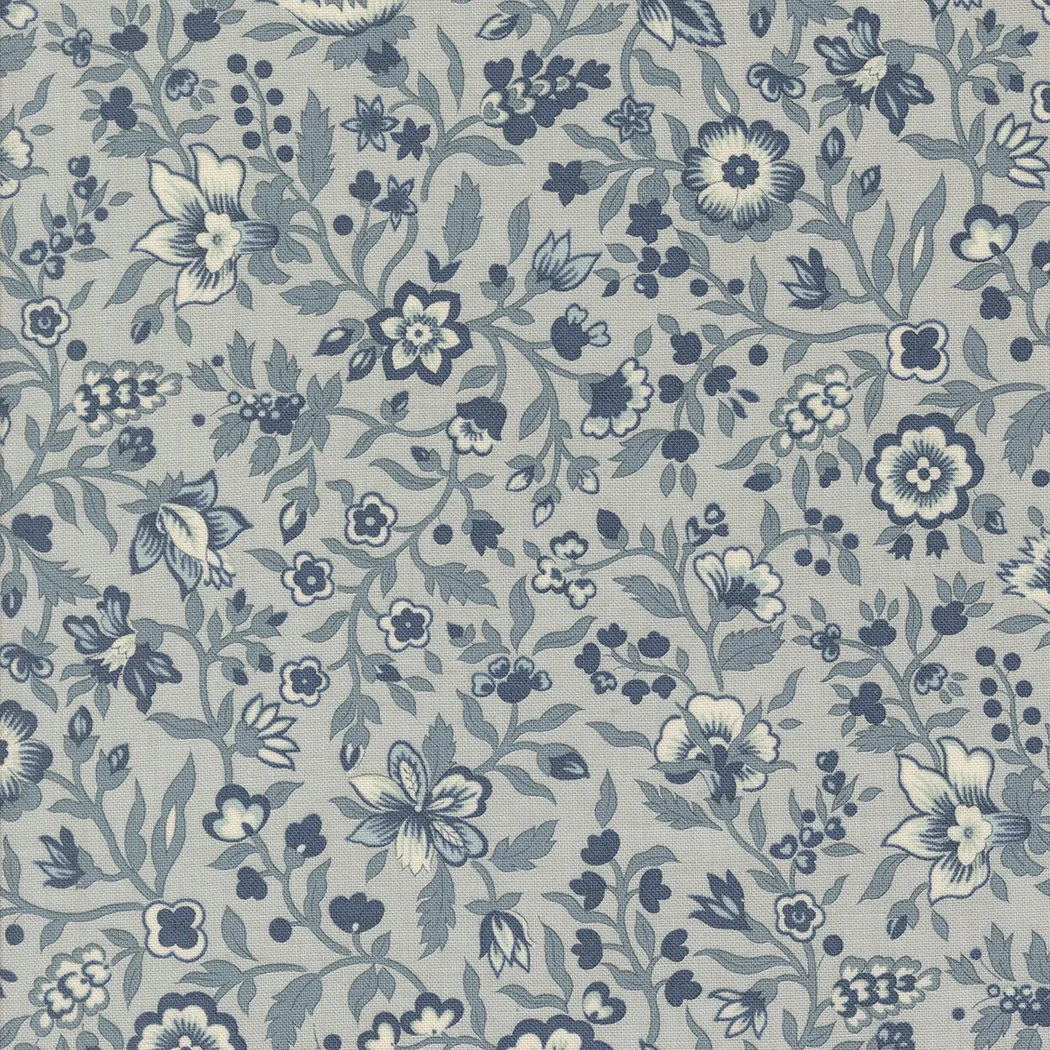 Blue and white floral patterned fabric with various flowers and leaves.