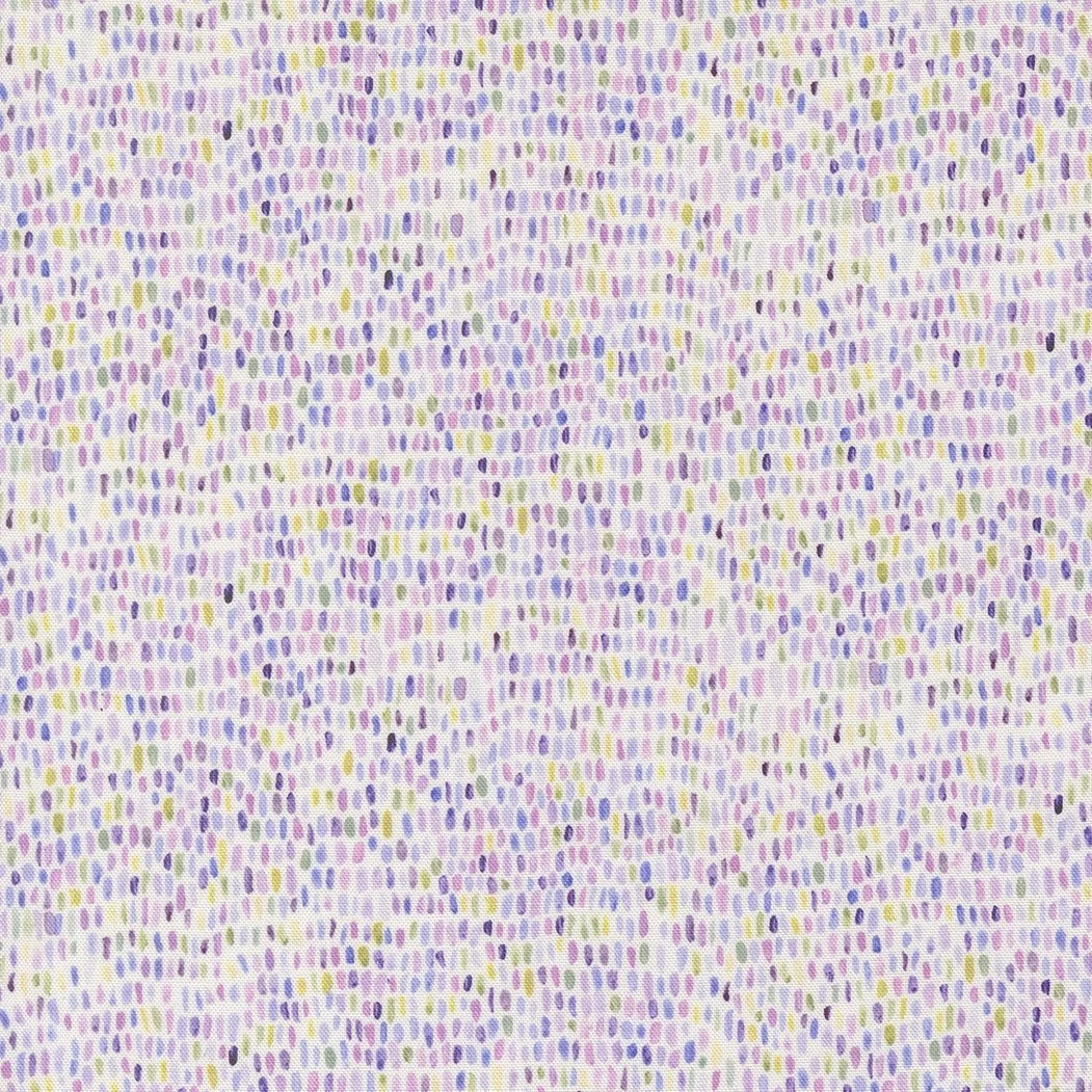 Close-up view of fabric with small, colorful dotted pattern in purple, yellow, green, and black on a light background.
