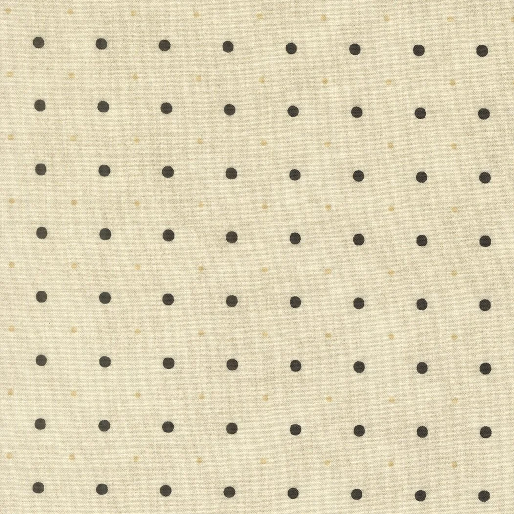 Beige fabric with evenly spaced black polka dots.