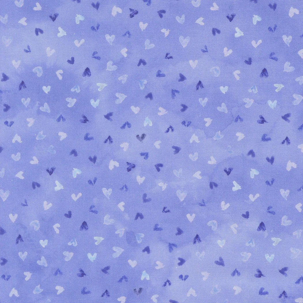 Blue fabric with a pattern of small white and dark blue hearts.