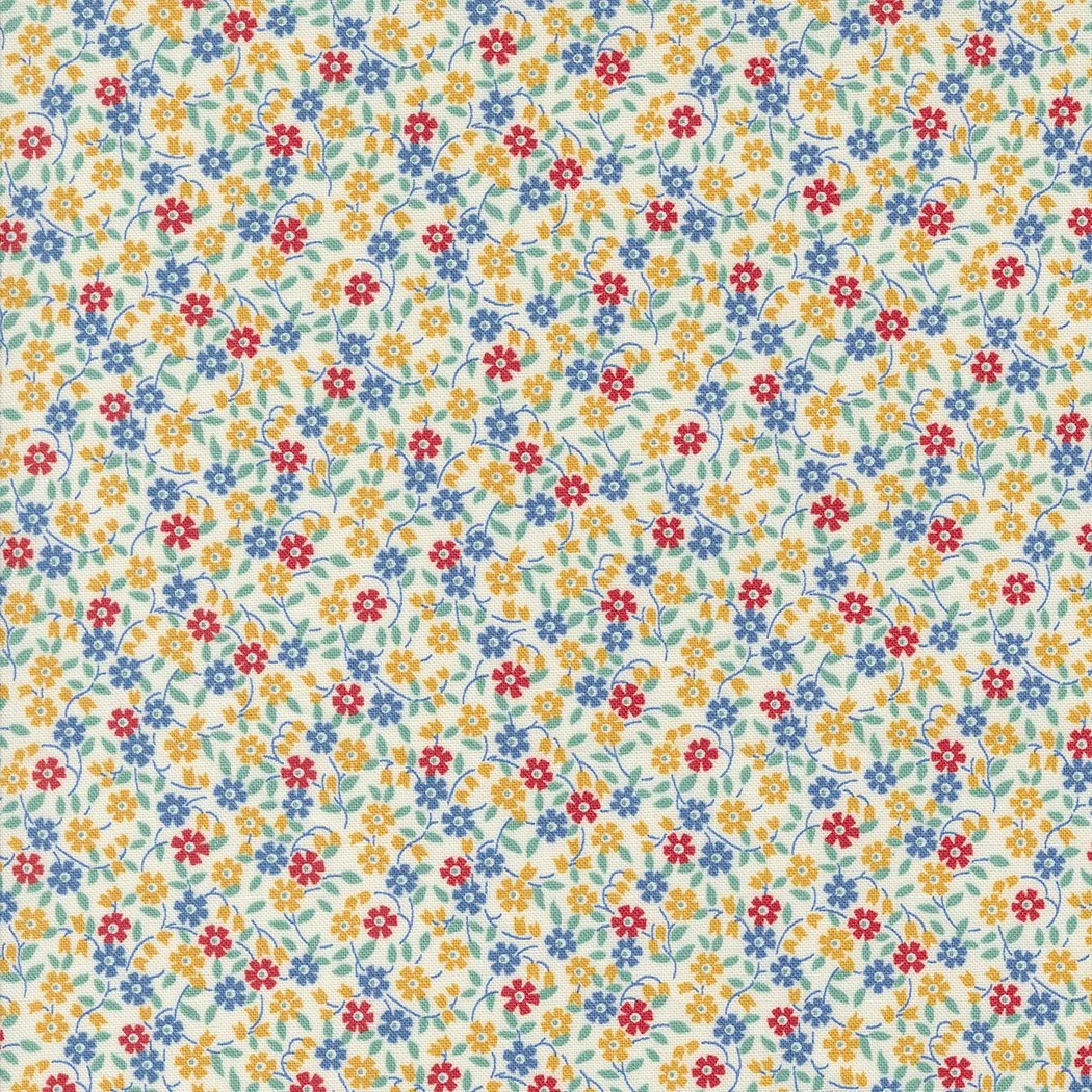 Close-up of a fabric with a small floral pattern featuring yellow, red, and blue flowers with green leaves on a white background.