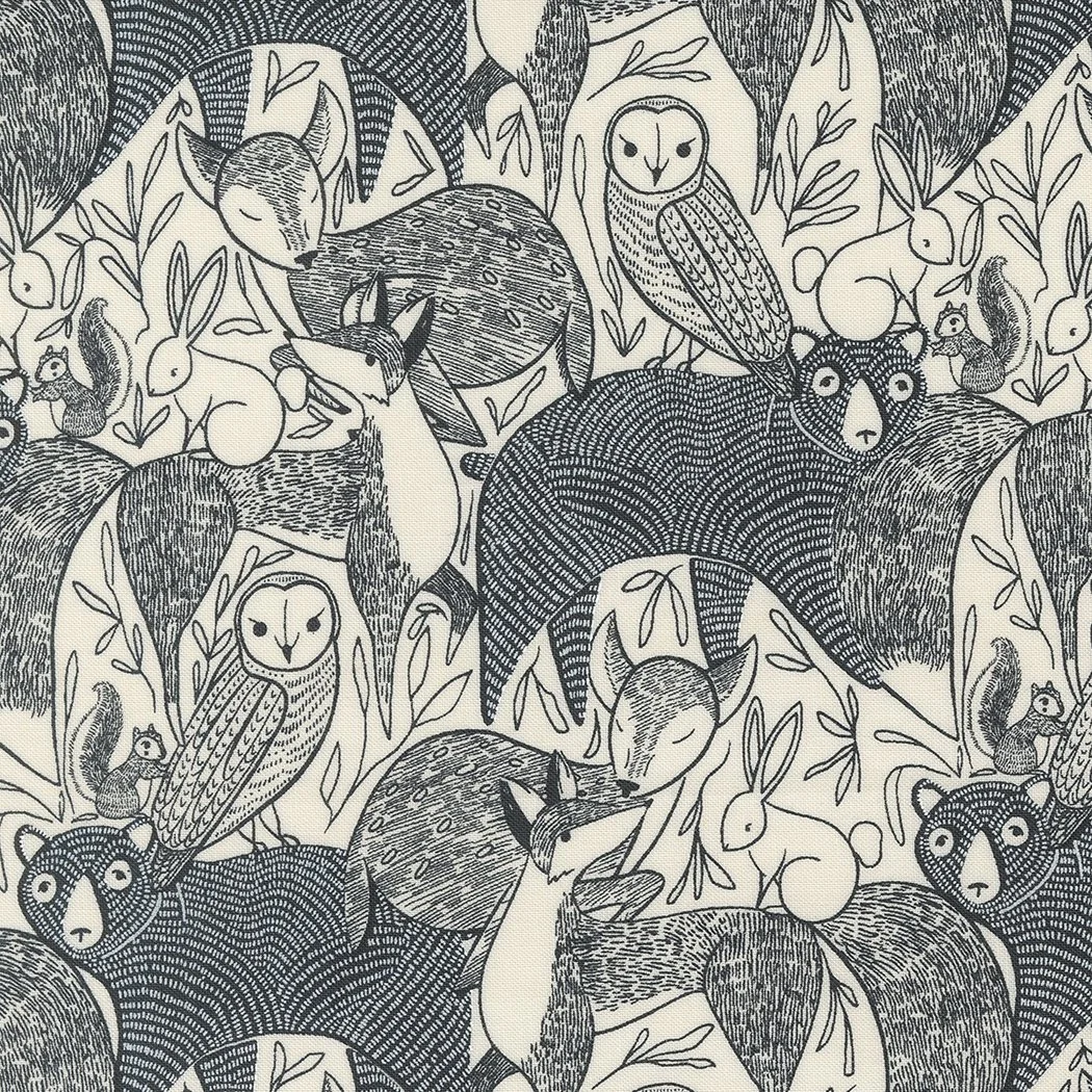 A patterned illustration of woodland animals including foxes, owls, rabbits, deer, and bears, surrounded by leaves and branches.
