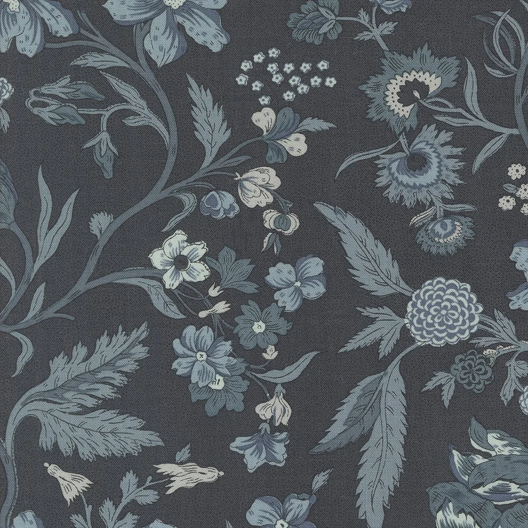 Blue floral patterned fabric with various flowers, leaves, and intricate designs on a dark background.