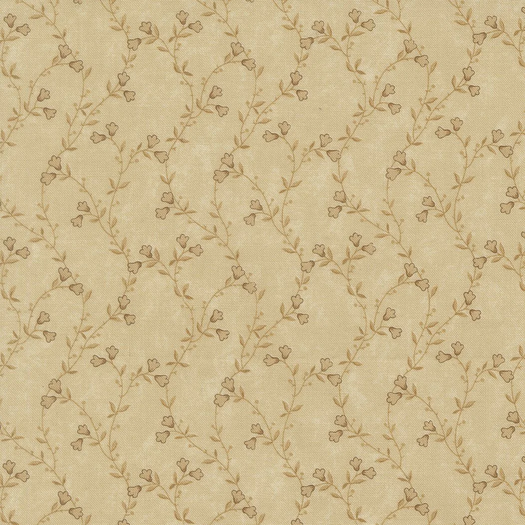 Beige fabric with a delicate brown floral pattern of small leaves and heart-shaped flowers.