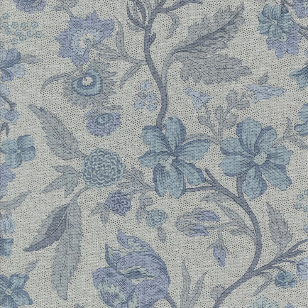 Close-up of a fabric with a light background featuring an intricate floral pattern in shades of blue and gray.