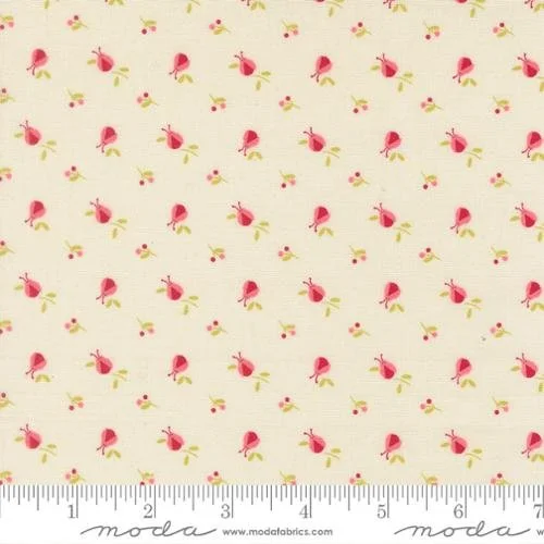 Pattern fabric with pink roses and green leaves on a cream background.