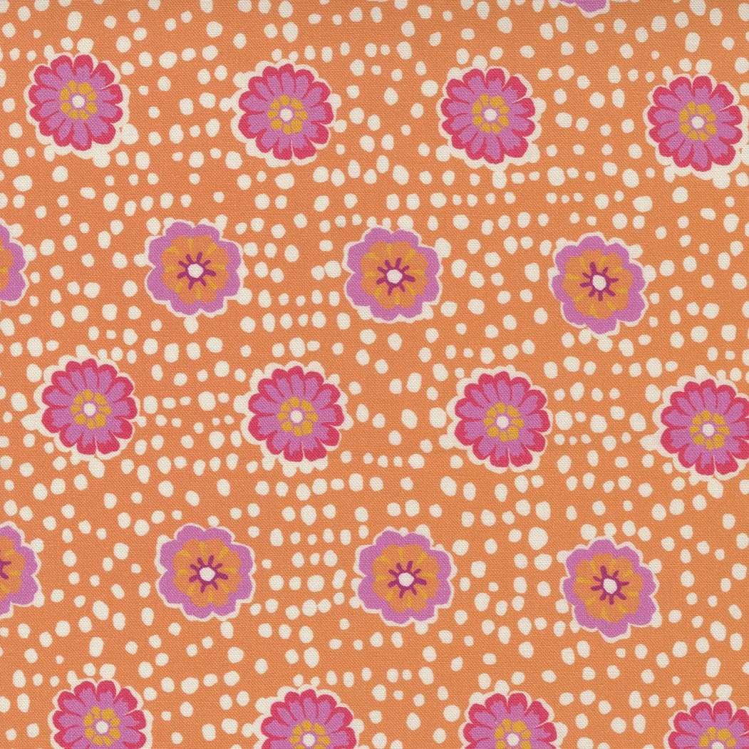 A fabric with a pattern of pink and purple flowers on an orange background with white dots.