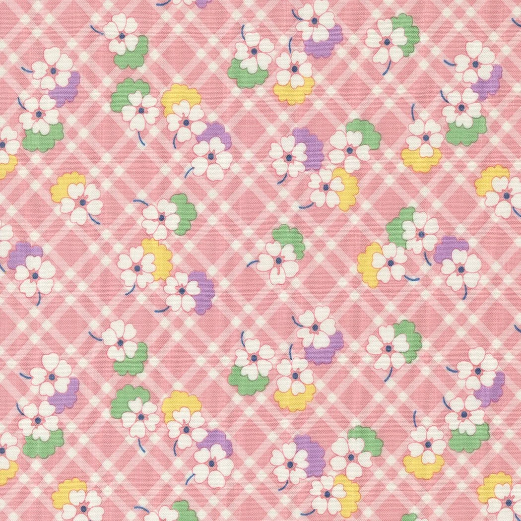 Pink floral fabric with white, purple, yellow, and green flowers and a checkered pattern.