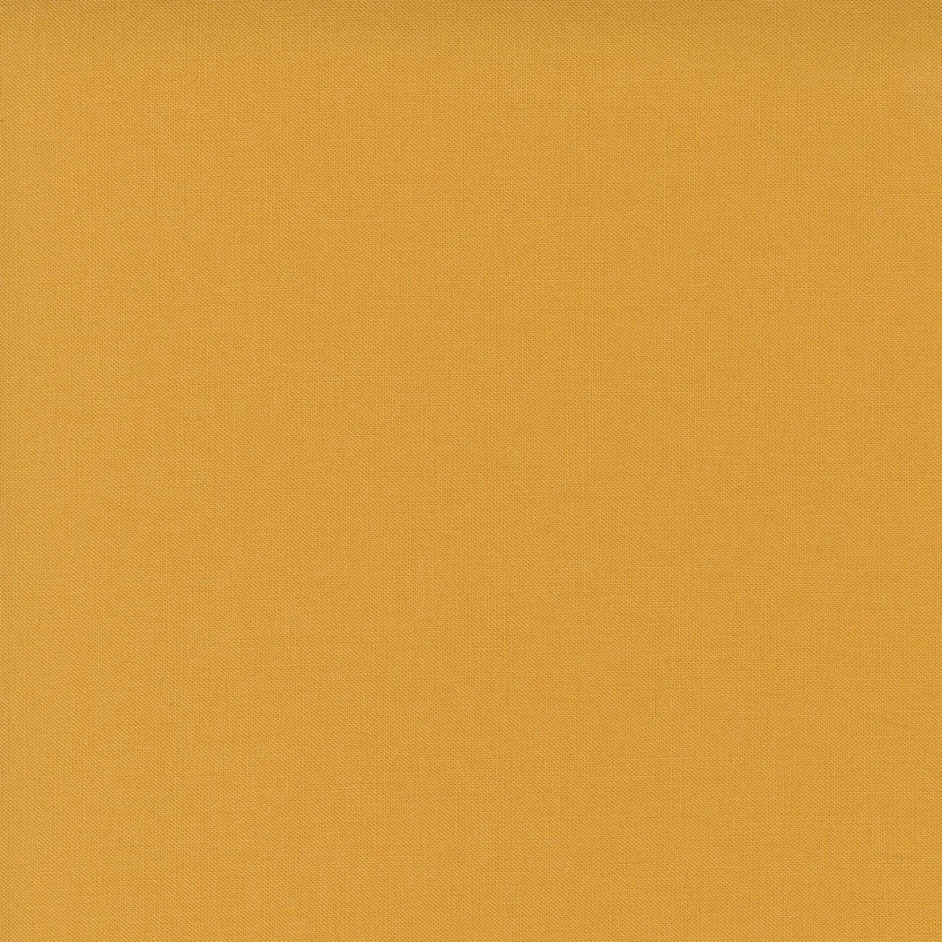 A close-up of a textured orange fabric.