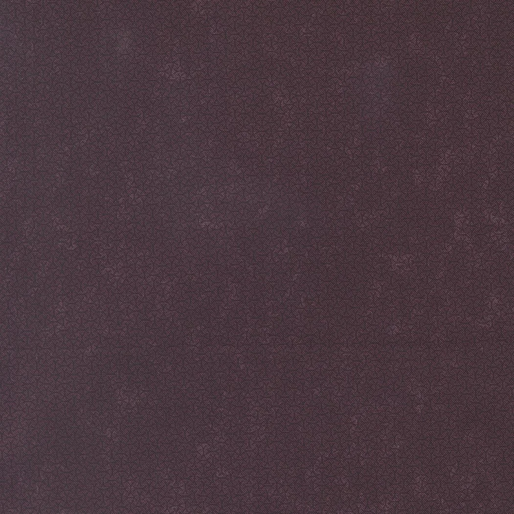 Close-up of textured maroon fabric.