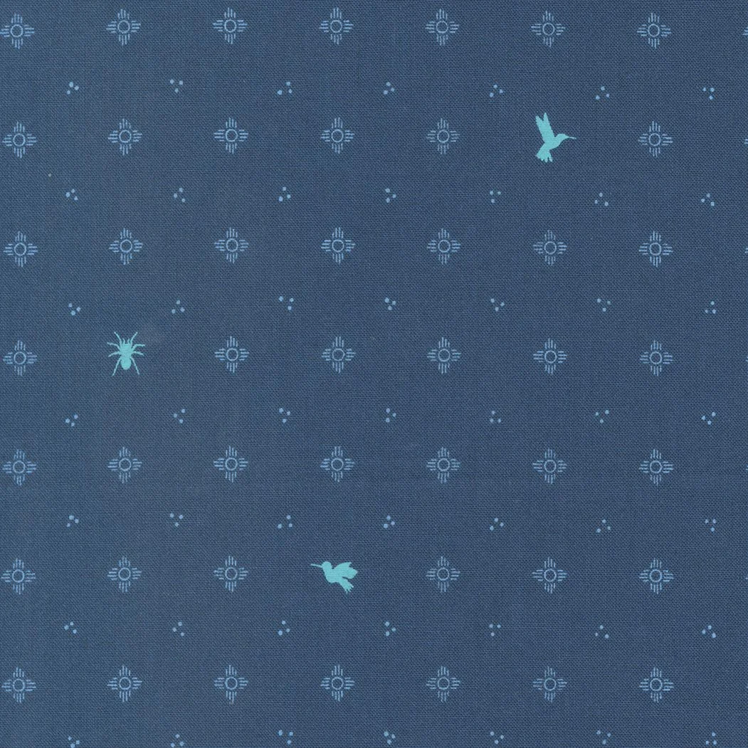 Pattern of small symbols resembling suns or flowers and tiny dots on dark blue fabric, with three flying insects visible in different positions.