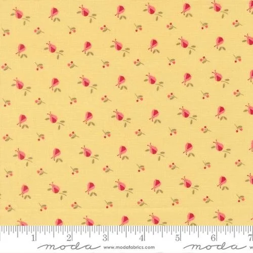 Yellow fabric with a repeating pattern of small pink umbrellas and tiny red and yellow flowers.