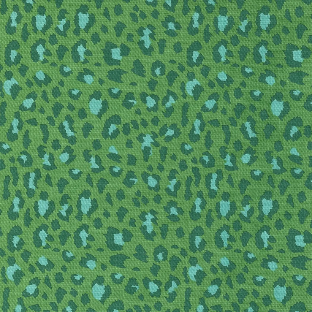 Green fabric with a blue and dark green leopard print pattern.