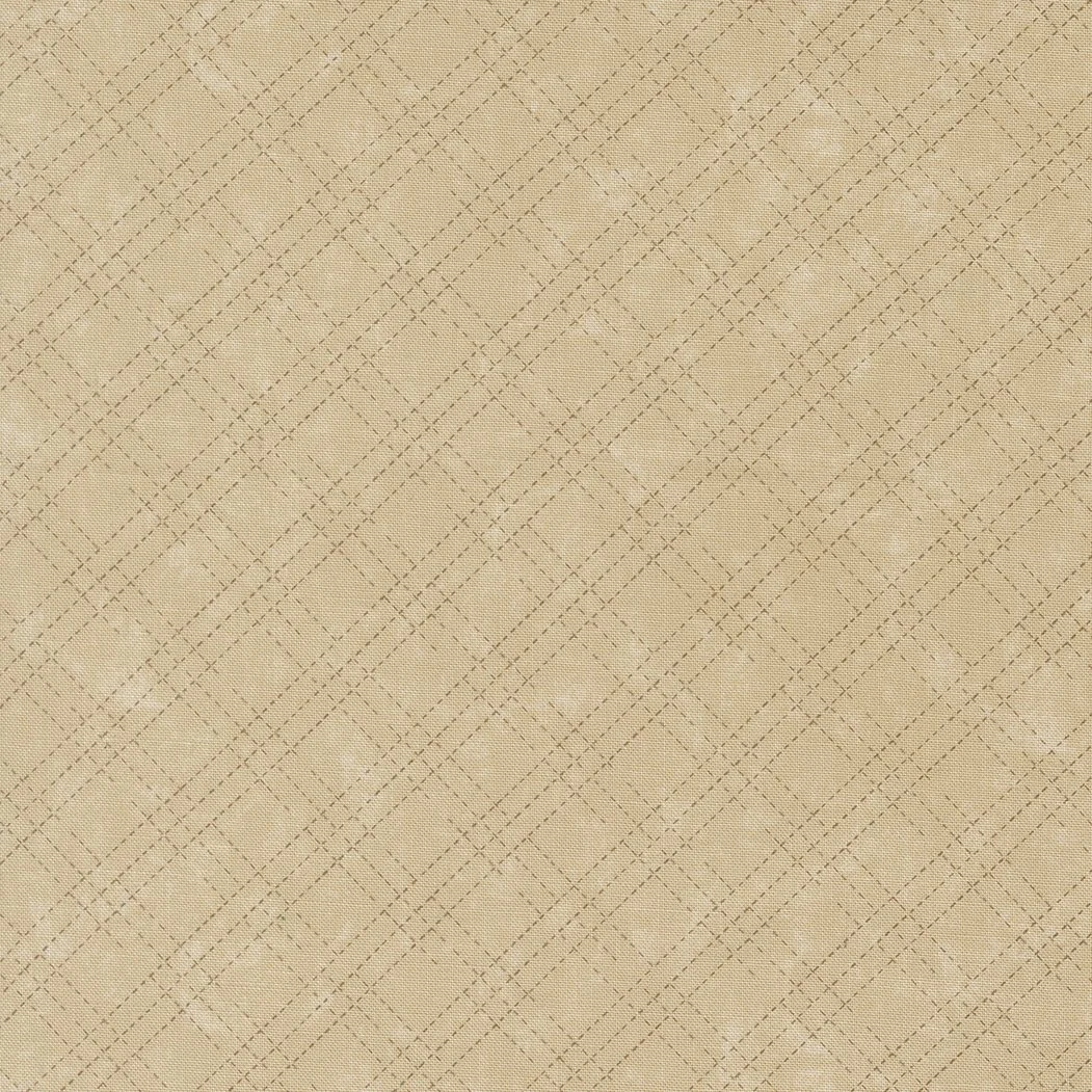A beige fabric with a diamond quilted pattern.