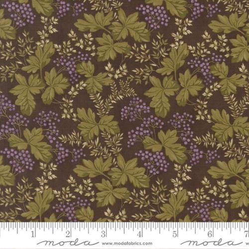 Fabric with a pattern of green leaves, purple berries, and small white flowers on a dark background.