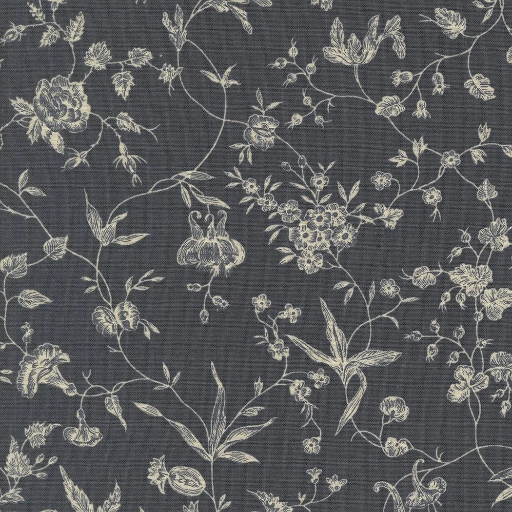 A fabric with a dark background and a white floral pattern featuring various flowers, leaves, and vines.