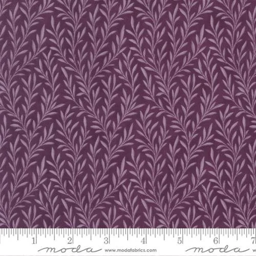 Purple fabric with a repeating pattern of light purple leafy branches