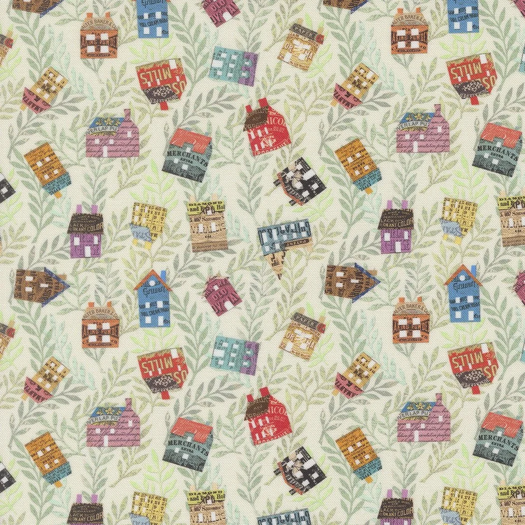 Fabric with a pattern of small colorful buildings and trees.