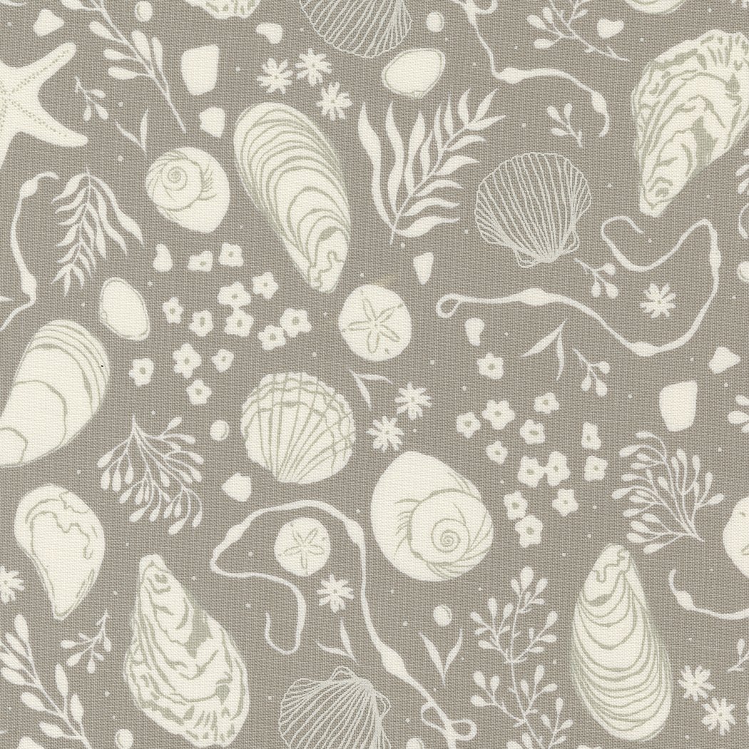A fabric pattern with shells, starfish, and seaweed illustrations on a gray background.