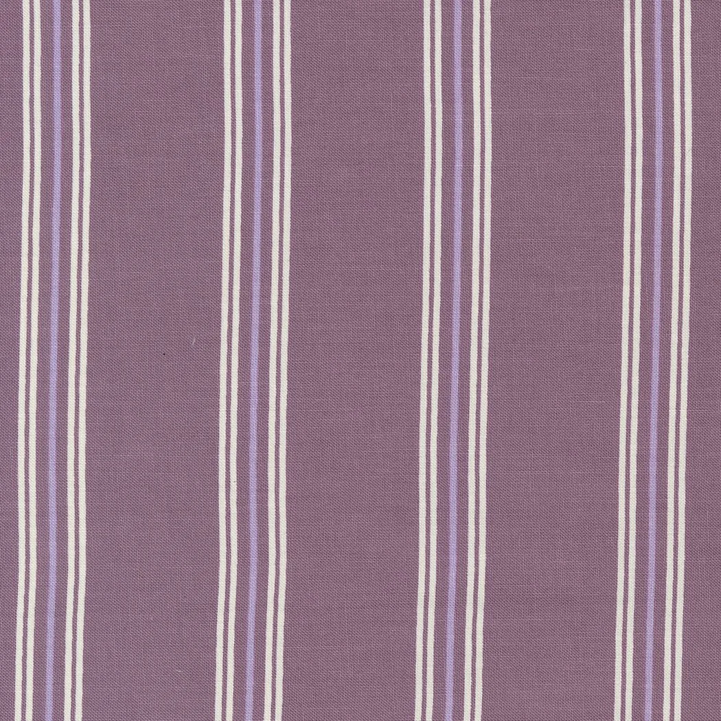 Close-up of purple fabric with vertical white, beige, and light purple stripes