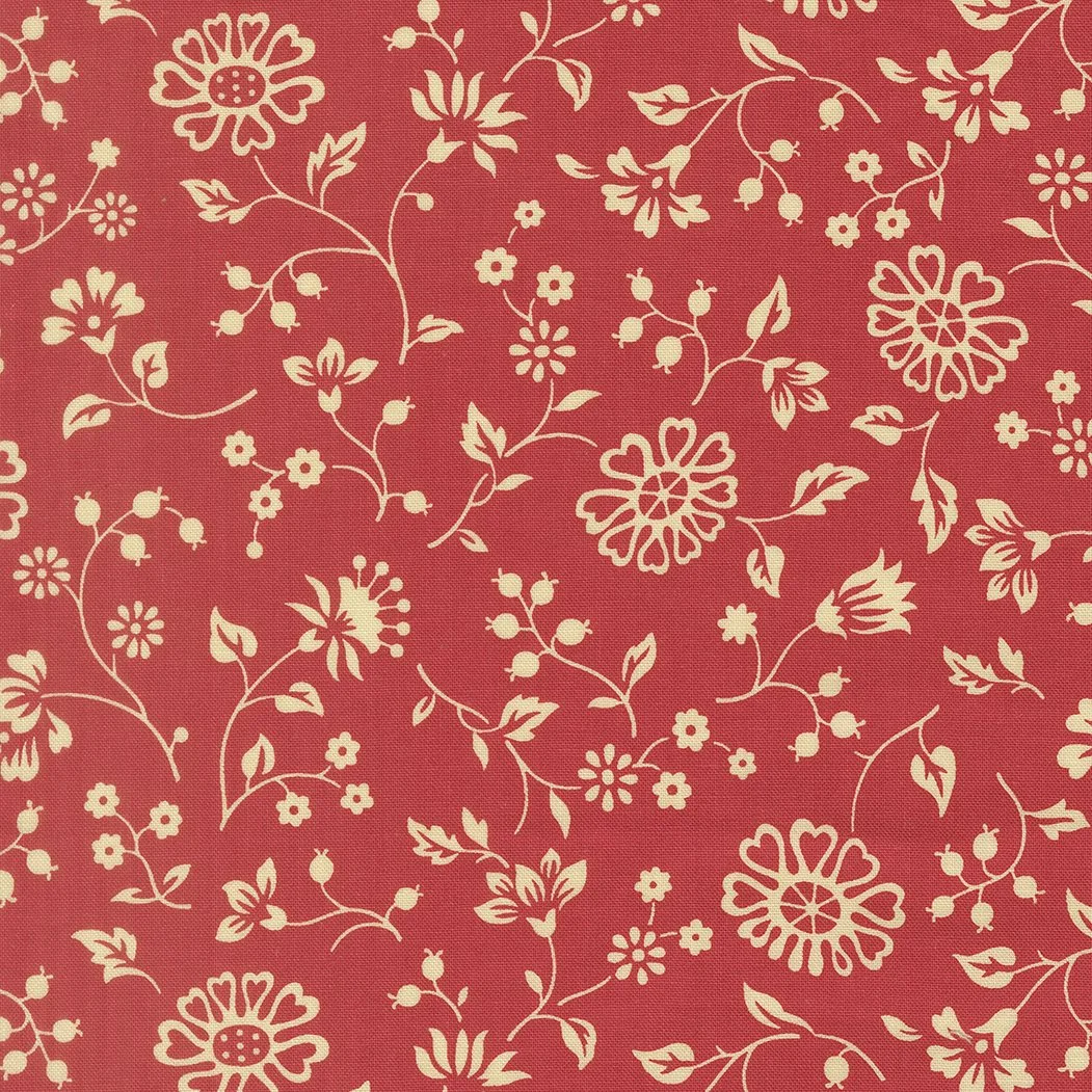 Red fabric with beige floral print pattern.