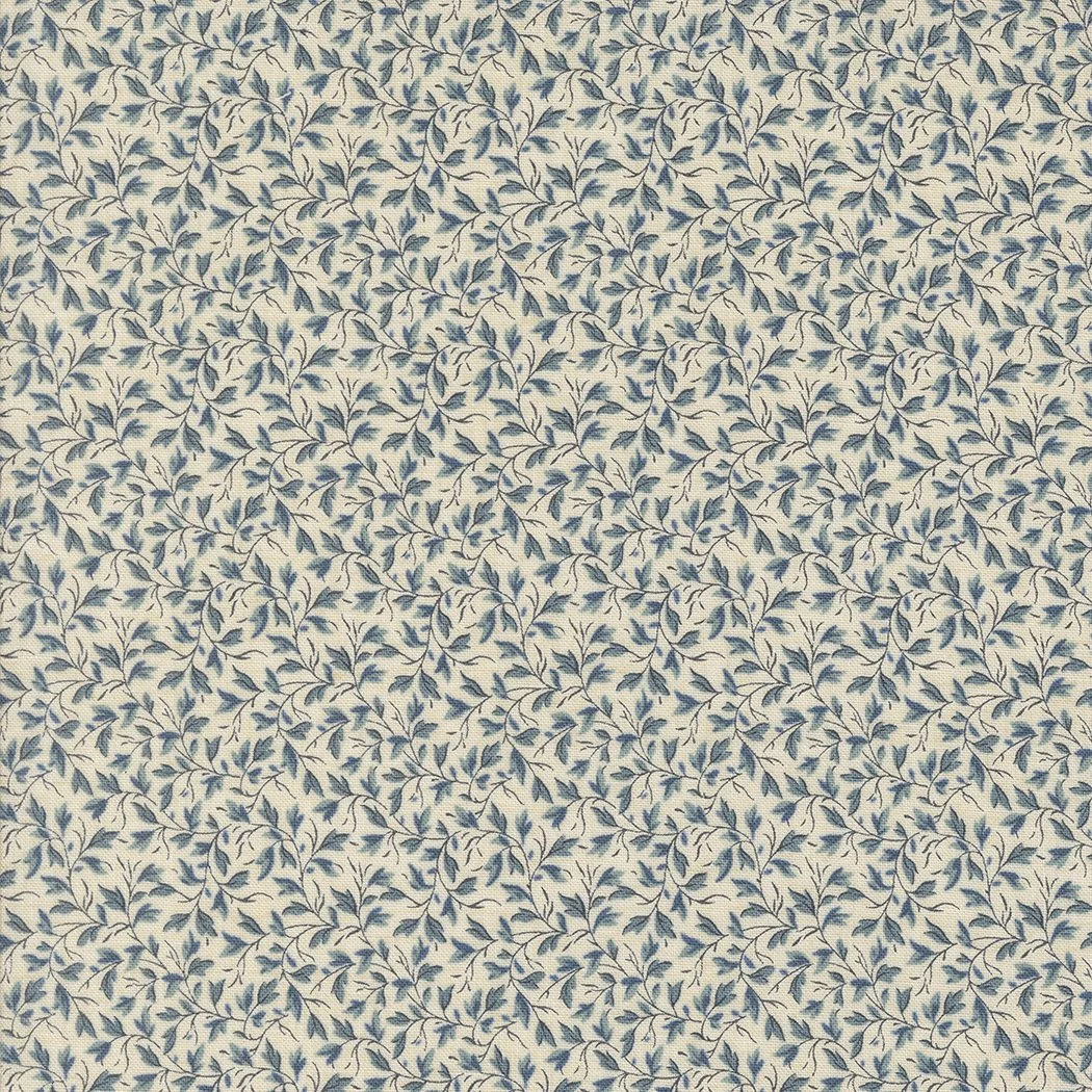Close-up of a fabric with a white background and a repeating pattern of small blue leaves and vines.