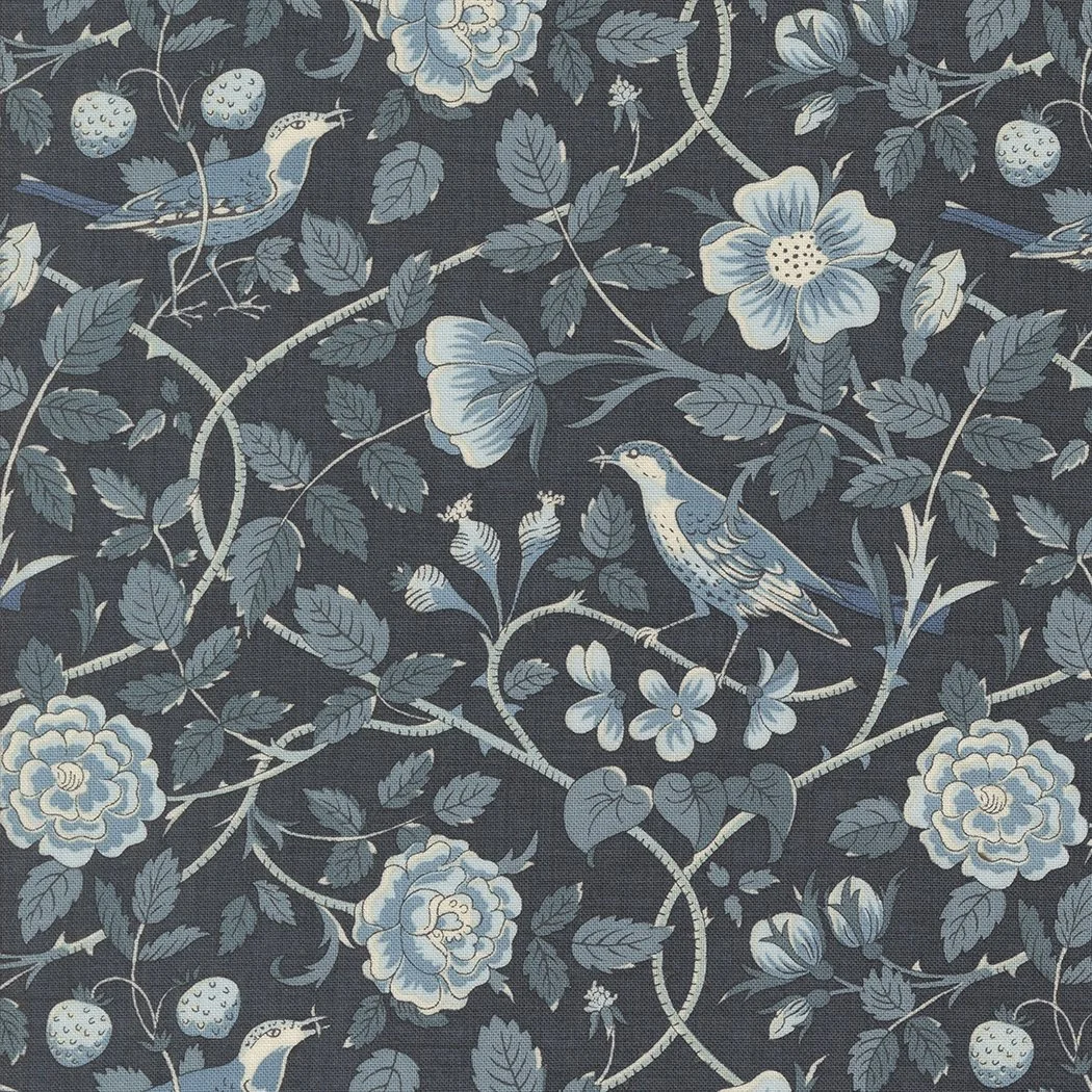 A dark fabric with a floral and bird pattern, featuring blue and white flowers, leaves, small berries, and birds perched on branches.