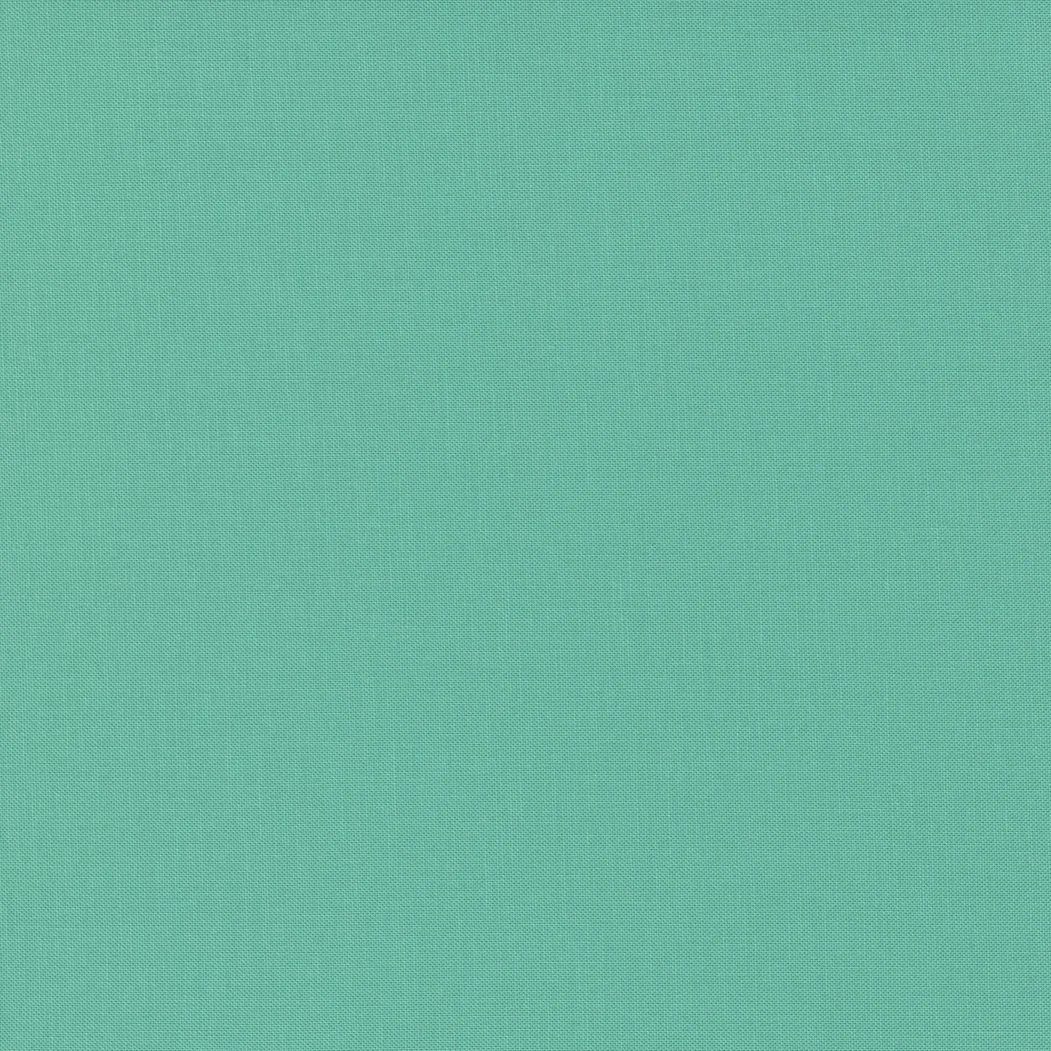 Solid teal-colored textured fabric or material