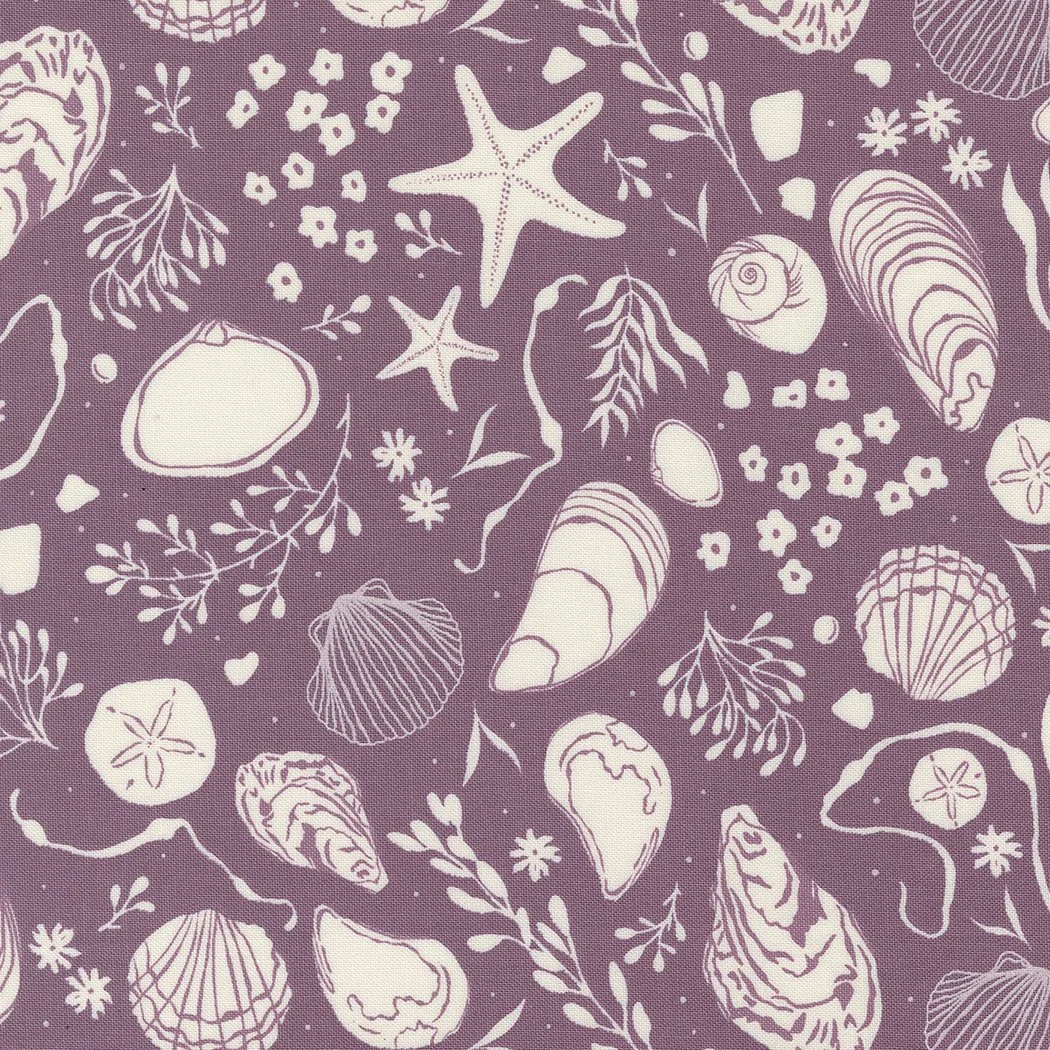 A purple fabric with a pattern of white seashells, starfish, and seaweed.