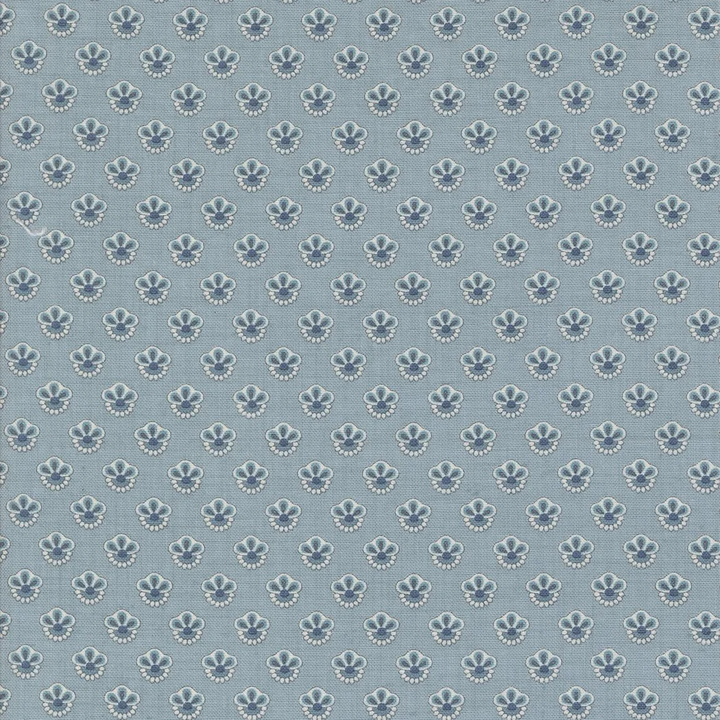 A fabric pattern with small, evenly spaced white and gray floral designs on a blue background.