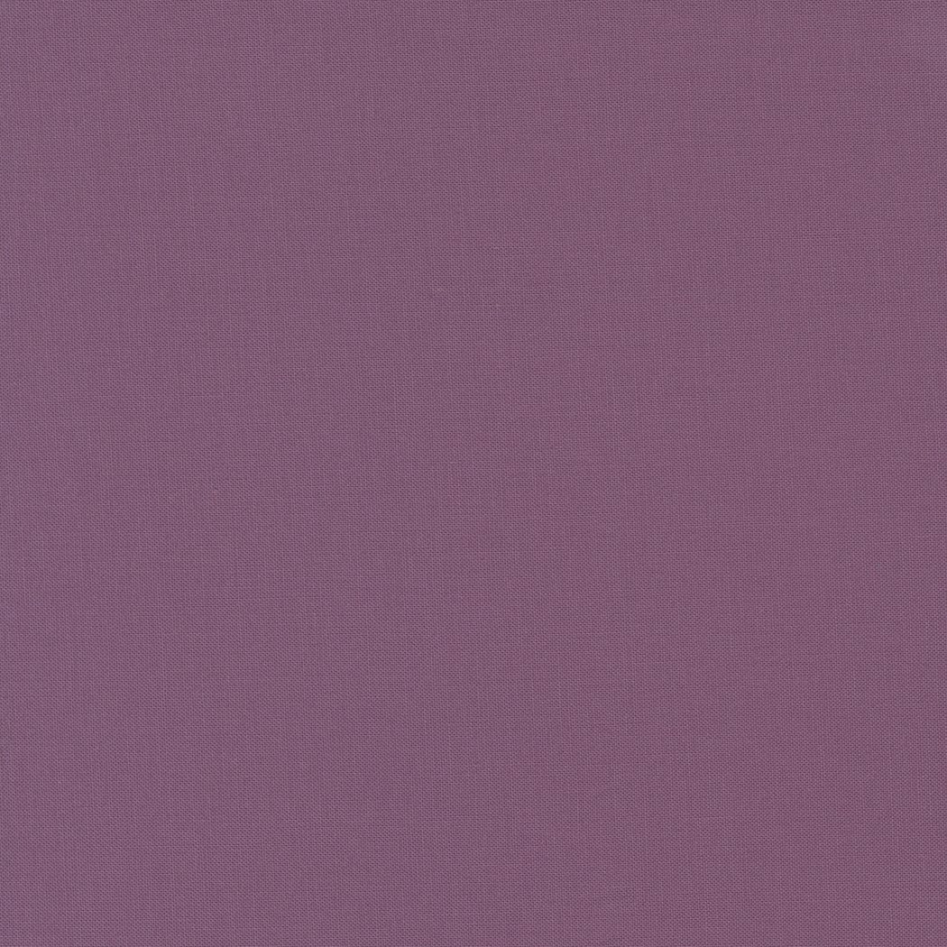 A textured purple fabric surface.