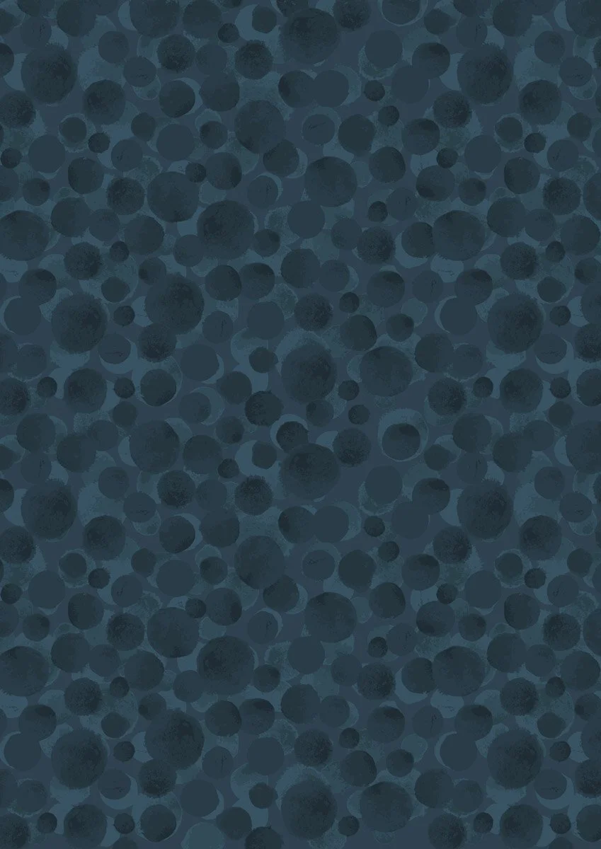 Close-up of numerous dark blue and gray polka dots on a textured background.